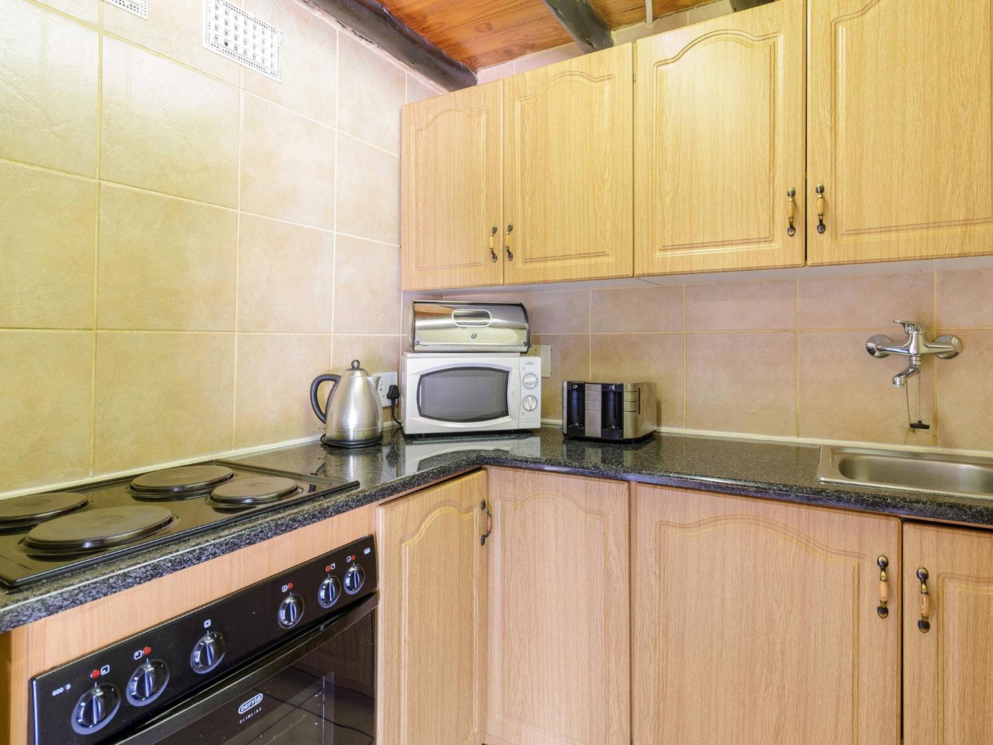 Dikhololo Apartment Brits Bilik gambar